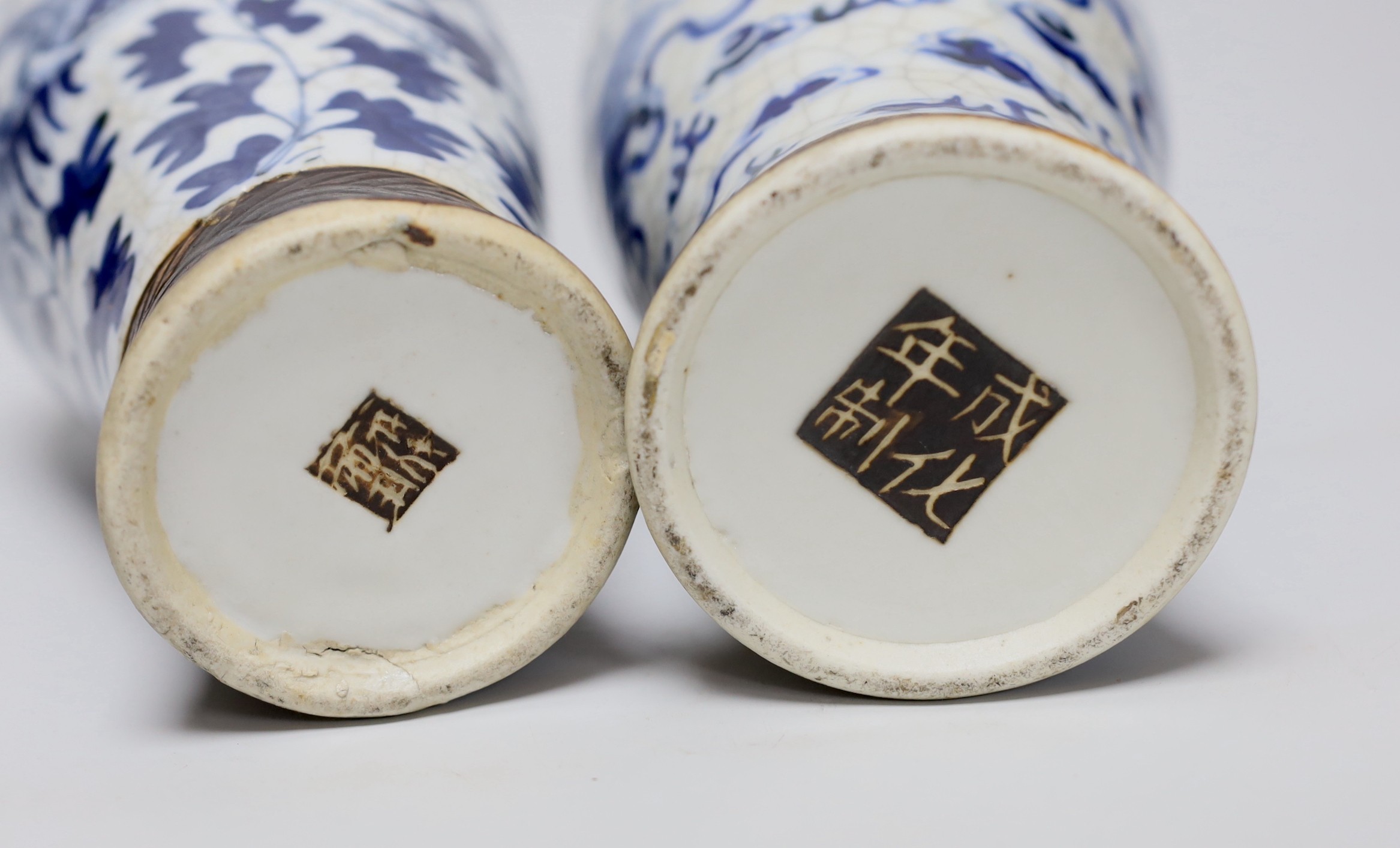 A pair of 19th century Chinese crackleglaze blue and white vases, 27cm